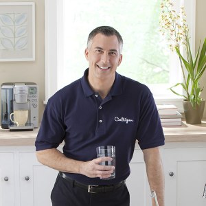 culligan water expert with glass of water